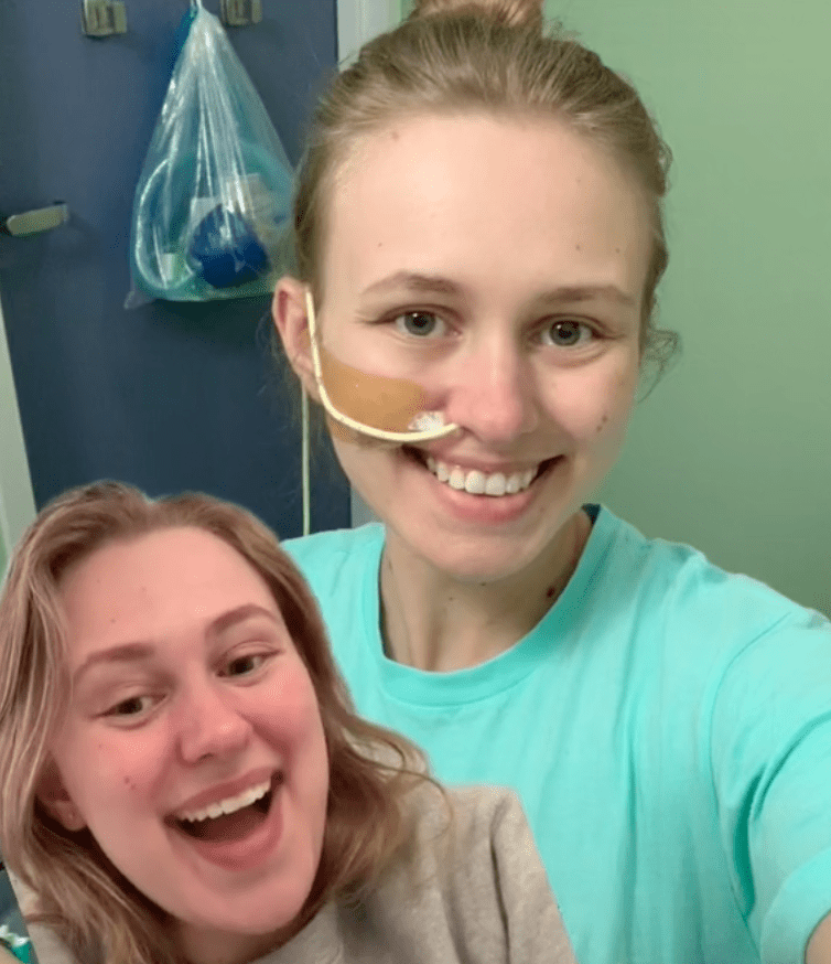 A TikToker shares a photo of herself with tubes coming out of her nose, outlining her long medical journey after getting a scrape on her bottom at Disneyland | Photo: ​TikTok/gamma.aminobutyric.acid