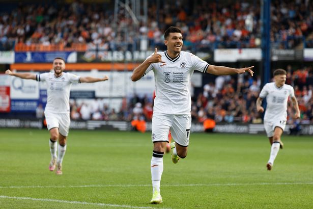 Savage swipe of Swansea player’s legs ‘most blatant red ever’ - but only gets a yellow Joel Piroe of Swansea City celebrates his goal during the Sky Bet Championship match between Luton Town and Swansea City at Kenilworth Road on September 18, 2021 in Luton, England.