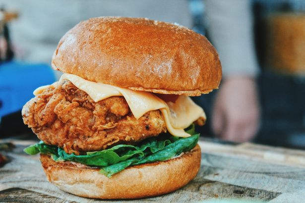US food chain Popeyes announces first UK location – with more on the horizon Popeyes chicken burger on a chopping board