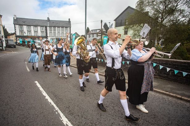 UK's smallest town transformed into mini Bavarian wonderland for Oktoberfest-style party The Oktoberfest event featured processions and oompah bands