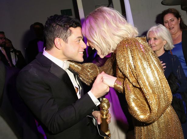 Inside Rami Malek's life – Bond villain, co-star romance and Bohemian Rhapsody Rami Malek and Lucy Boynton attend the FOX/HULU Golden Globe Awards viewing party and post-show celebration