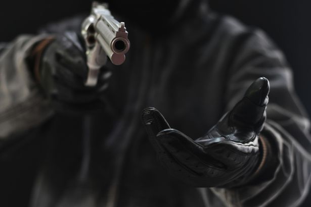 Bank robber's fake leg falls off mid-robbery as he's wrestled to ground by customers Robber stock image