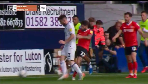 Savage swipe of Swansea player’s legs ‘most blatant red ever’ - but only gets a yellow Lansbury ran up to take a quick-free quick as Manning looked to slow the game down