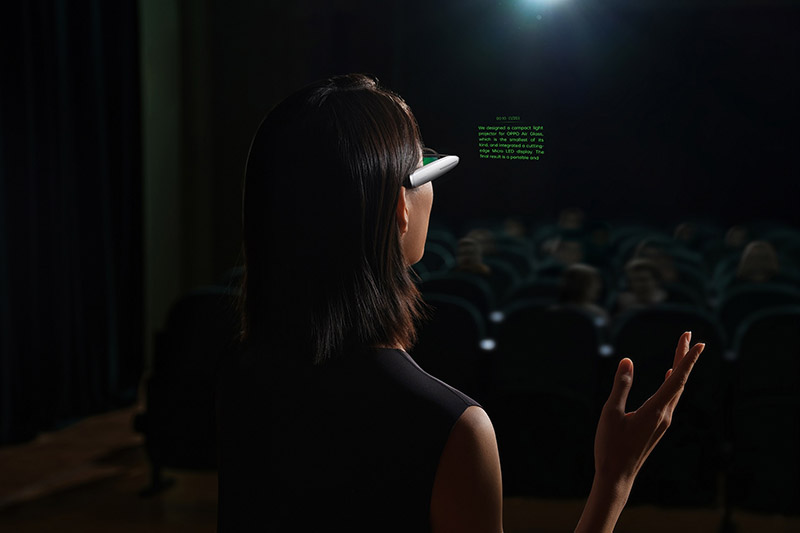 A person giving a speech wearing the Oppo Air Glass
