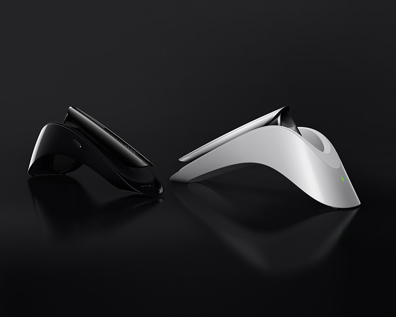 Black and silver Oppo Air Glass in their charging cradles